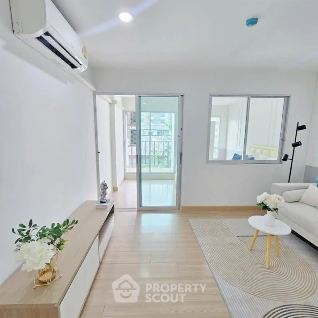 Modern living room with air conditioning and stylish decor in a bright apartment.