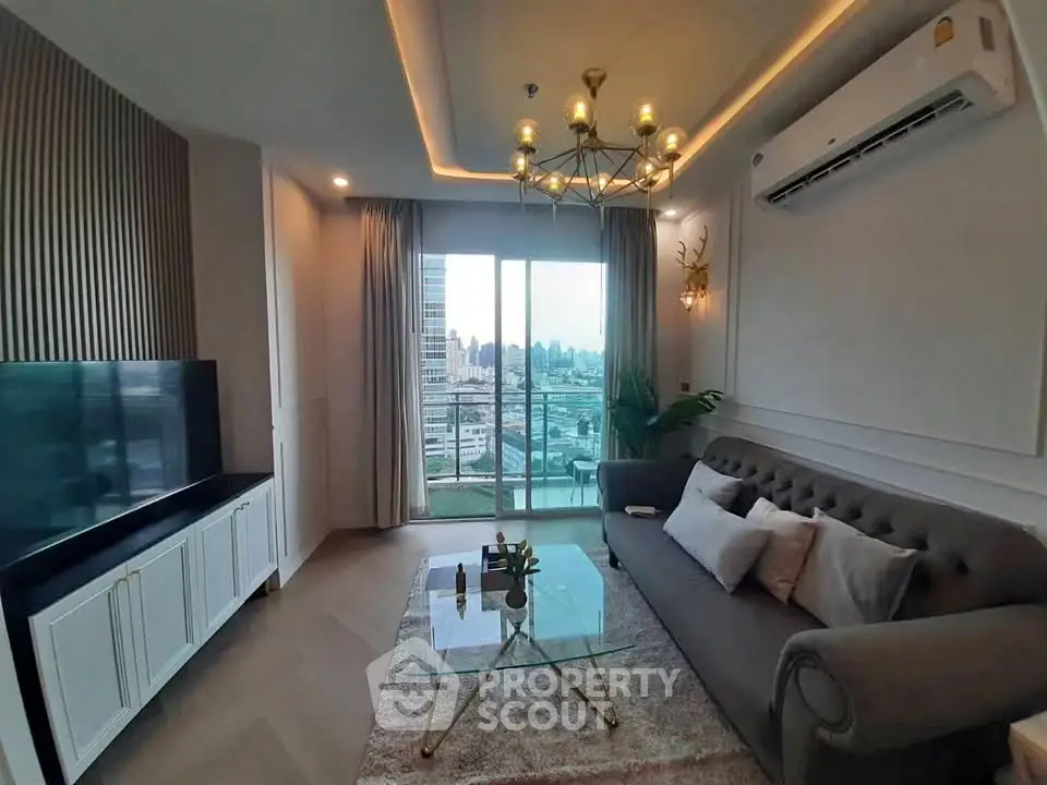 Luxurious living room with city view, elegant chandelier, and modern decor