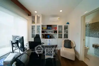 Modern home office with sleek furniture and ample natural light
