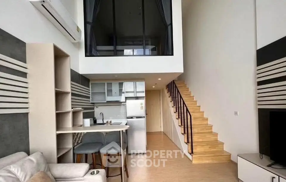 Modern loft apartment with stylish open kitchen and mezzanine level