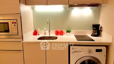 Modern kitchen with built-in appliances and sleek design