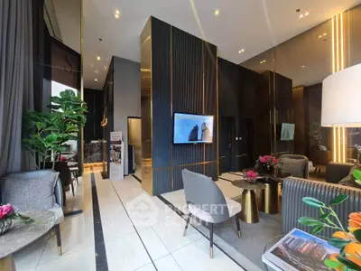 Luxurious modern lobby with elegant seating and stylish decor in a high-end building.