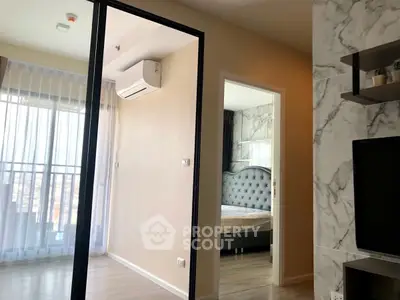 Modern apartment interior with stylish bedroom and living area, featuring elegant decor and natural light.