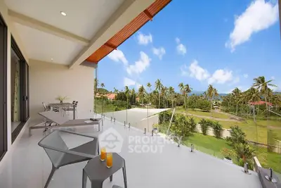 Luxurious balcony with stunning tropical view and modern outdoor furniture.