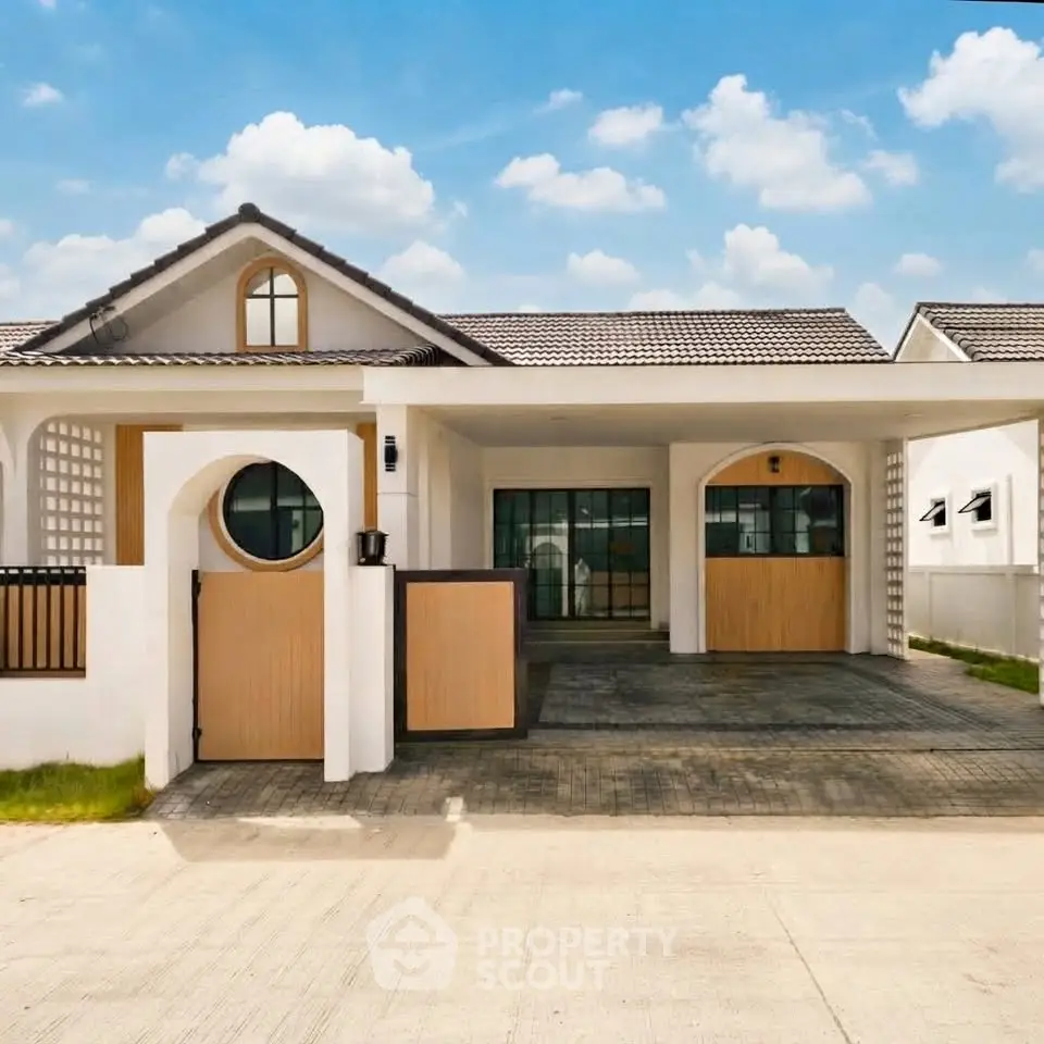 Charming modern bungalow with spacious driveway and elegant facade under a clear blue sky.
