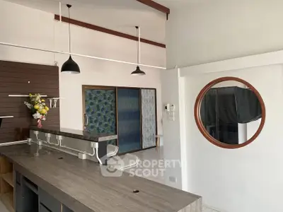 Modern kitchen with open layout and stylish pendant lighting