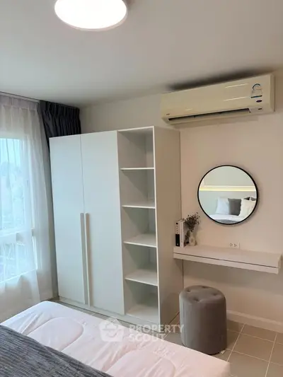 Modern bedroom with air conditioning and stylish decor