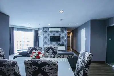 Spacious modern living room with elegant dining area and stylish decor