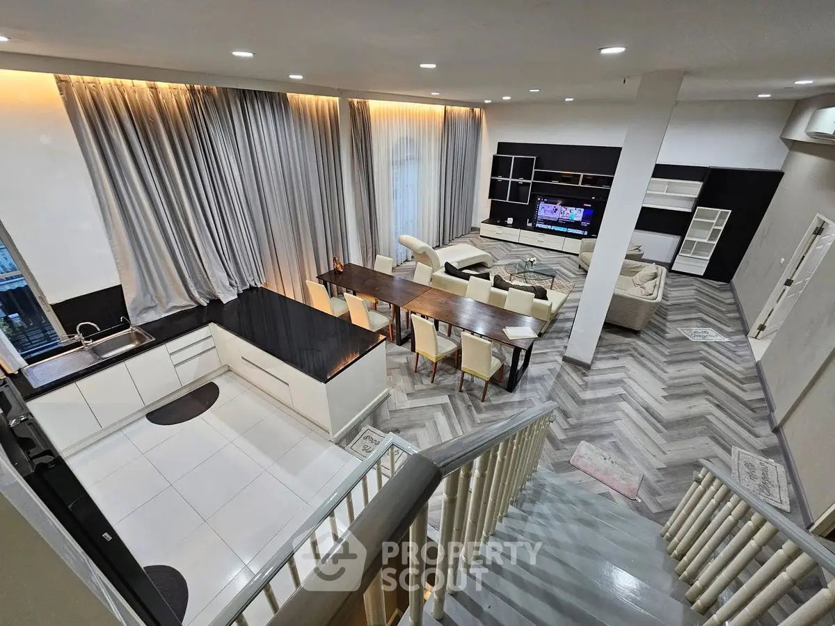 Luxurious open-plan living room with elegant dining area and modern kitchen