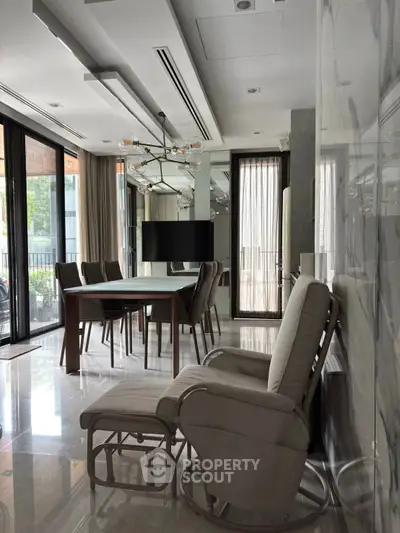 Luxurious modern living room with elegant dining area and stylish furniture