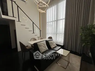 Luxurious modern living room with high ceilings and elegant staircase