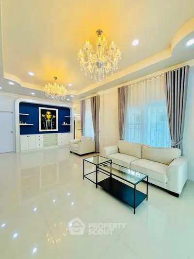 Luxurious living room with elegant chandeliers and modern decor
