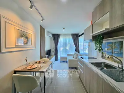 Modern open-layout kitchen and living room with elegant decor and natural light