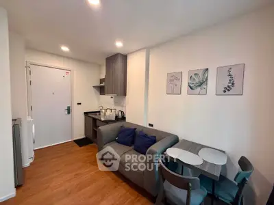 Modern compact living room with cozy sofa and dining area in stylish apartment.