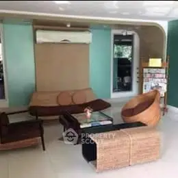 Stylish modern living room with wicker furniture and air conditioning