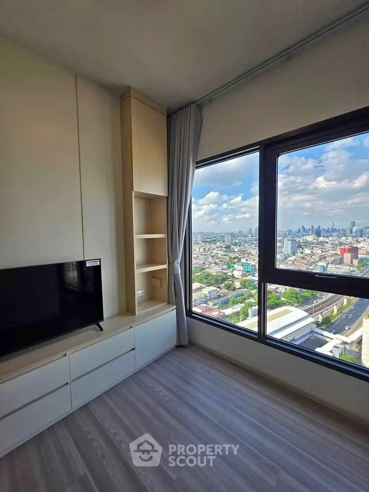 Modern living room with stunning city view and sleek built-in storage
