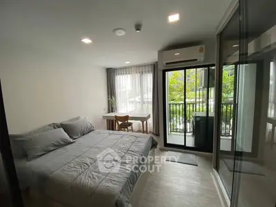 Modern bedroom with balcony view in a stylish apartment