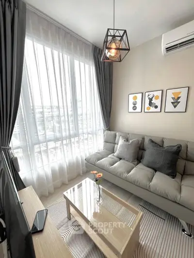 Modern living room with stylish decor and large window view