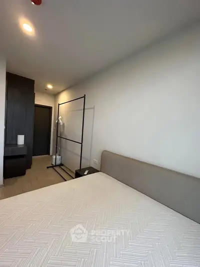 Modern bedroom with minimalist design and neutral tones