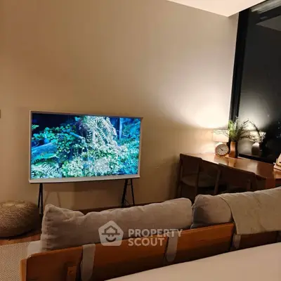 Cozy living room with modern TV setup and stylish decor
