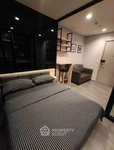 Modern studio apartment with stylish bedroom and cozy living area