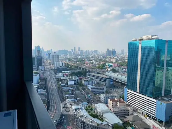 Stunning cityscape view from high-rise balcony with expansive skyline and modern architecture.
