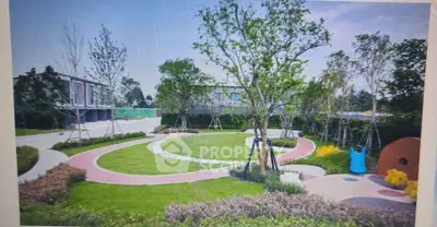 Beautiful landscaped garden with walking paths and play area in modern residential complex.