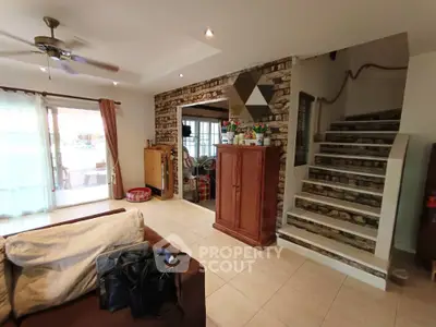 Charming living room with rustic stone accents and cozy decor