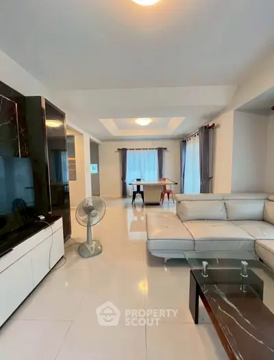 Spacious modern living room with elegant furniture and natural light
