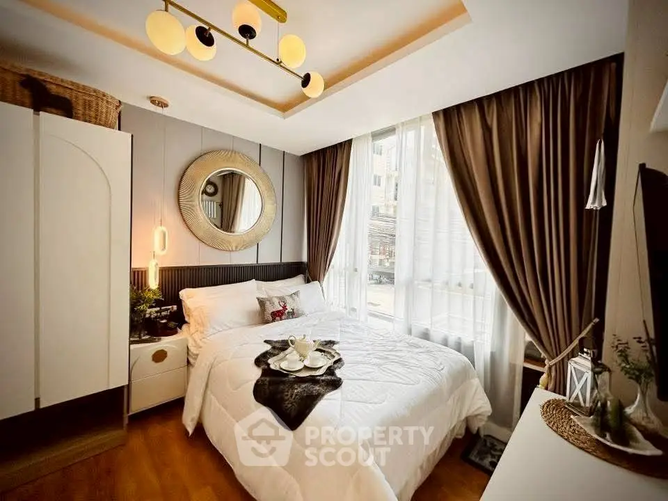 Luxurious bedroom with elegant decor and large window for natural light