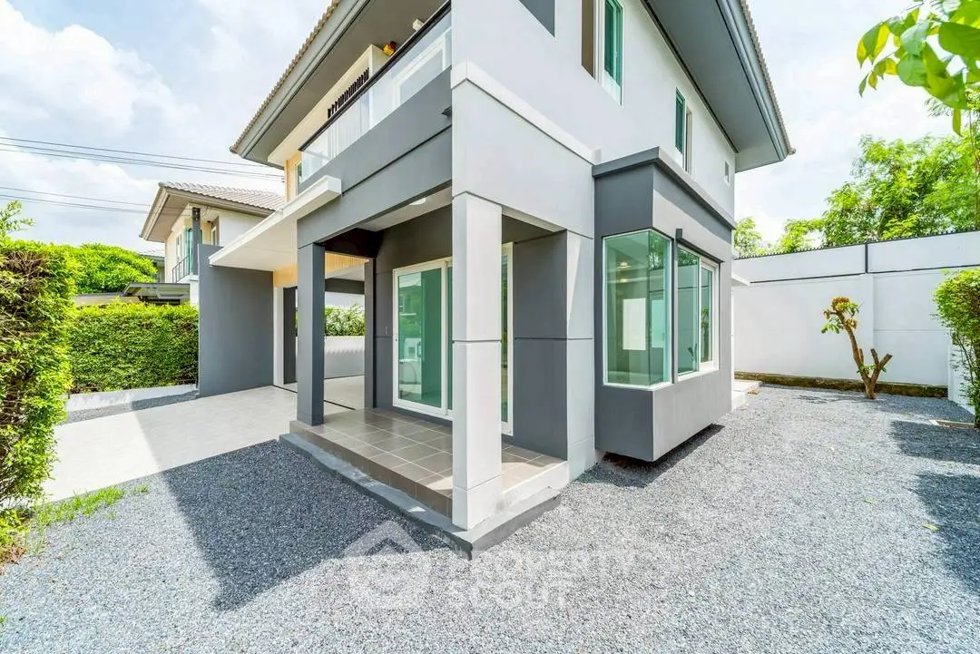 Modern two-story house with sleek design and spacious outdoor area