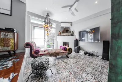 Chic living room with eclectic decor and patterned tile flooring