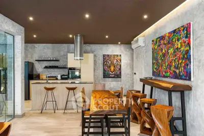 Modern kitchen with stylish wooden dining set and vibrant artwork