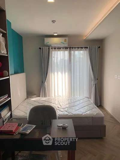 Modern bedroom with natural light and stylish decor