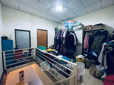Cozy storage room with clothes rack and organized shelving