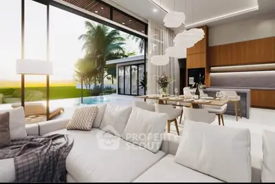 Luxurious open-plan living room with pool view and modern kitchen in a tropical villa.