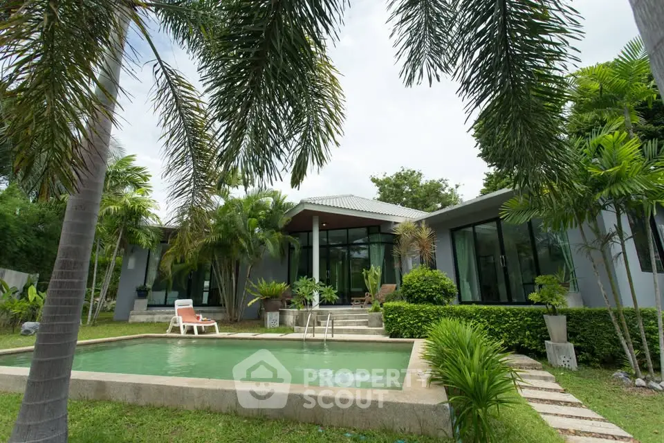 Luxurious modern villa with private pool and lush garden, perfect for tropical living.