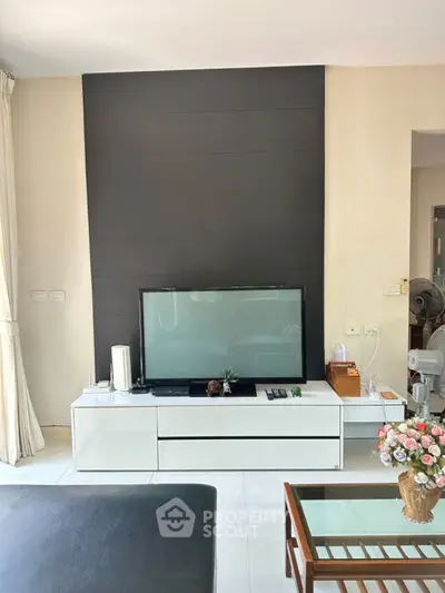 Modern living room with sleek TV setup and stylish decor