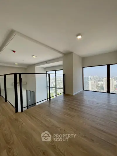 Spacious modern apartment with stunning city view and elegant wooden flooring.