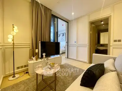 Elegant living room with modern decor and cozy ambiance, featuring a stylish TV setup and plush seating.