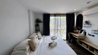 Modern bedroom with large window and stylish decor