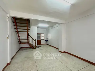 Spacious interior with staircase and minimalist design, ideal for customization.