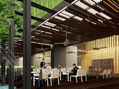 Luxurious outdoor dining area with modern design and lush greenery, perfect for entertaining guests.