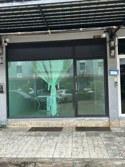 Charming commercial storefront with large glass windows and modern design, perfect for retail or office space.