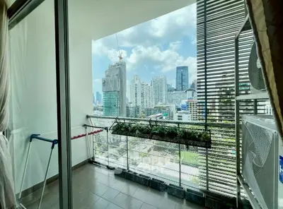 Spacious balcony with stunning city skyline view, perfect for relaxation and enjoying urban living.