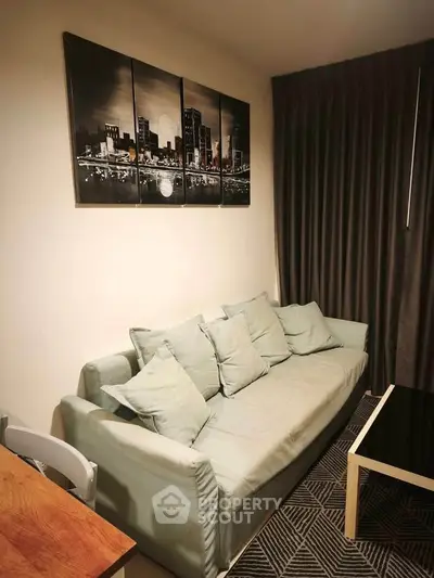 Cozy living room with modern decor and comfortable sofa in a stylish apartment.