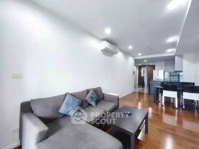 Spacious modern living room with open kitchen and stylish furniture