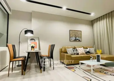 Modern living room with stylish decor, cozy sofa, and elegant dining area in a contemporary apartment.