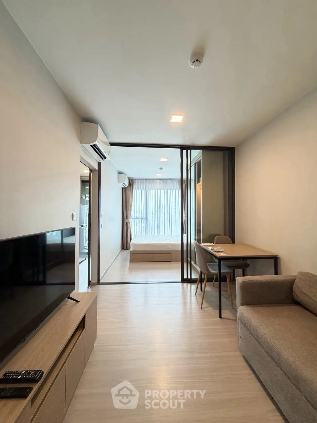 Modern living room with sleek furniture and natural light in a stylish apartment