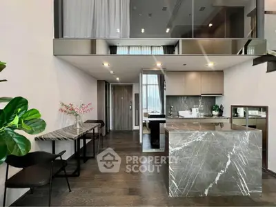 Luxurious modern kitchen with marble island and open layout in stylish apartment